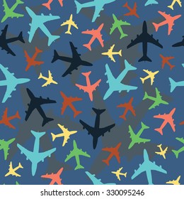 Seamless pattern with airplanes. Blue background and multicolored smaller airplanes in front. Perfect for children's bedding. Vector.