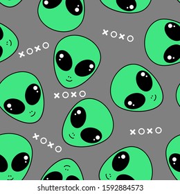 Seamless pattern of alien face on background vector illustration. funny cartoon character.