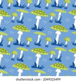 Seamless pattern with amanita mushrooms with bright green hat and white dots and grass on a blue background. Cute fly agaric print