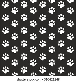 Seamless pattern with animal paw print on black background. Vector footprint.