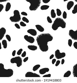 Seamless pattern with animal paw prints. Dog or cat hand drawn paw print.