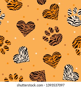 Seamless pattern of animal skin in shape of heart and paw: leopard, tiger and zebra. Trendy animal print. Fashion vector illustration.