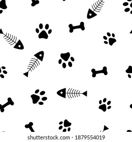 Seamless pattern of animals paws, bones and fish skeleton. Vector illustration on a white background.