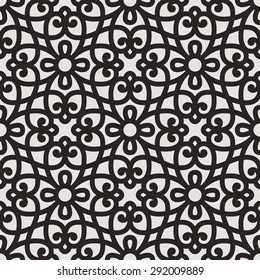 Seamless pattern in Arabic style. Intersecting curved elegant lines and scrolls forming abstract floral ornament. Arabesque.