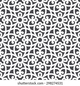 Seamless pattern in Arabic style. Intersecting curved elegant lines and scrolls forming abstract floral ornament. Arabesque.