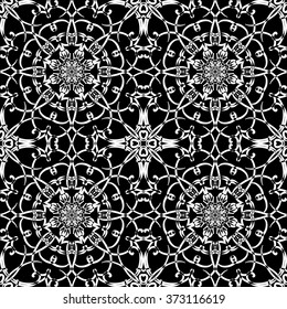 Seamless pattern in arabic style. Intersecting curved elegant lines and scrolls forming abstract floral ornament. Arabesque.