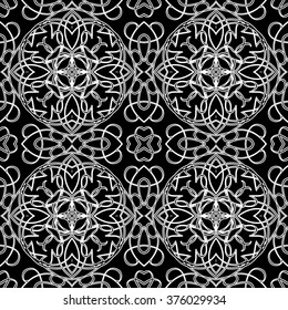 Seamless pattern in arabic style. Intersecting curved elegant lines and scrolls forming abstract floral ornament. Arabesque