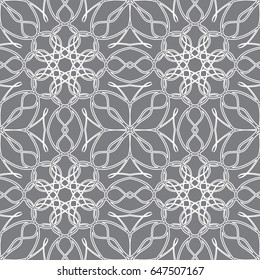 Seamless pattern in arabic style. Intersecting curved elegant lines and scrolls forming abstract floral ornament. Arabesque