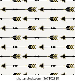 Seamless pattern with arrows in black and yellow, tribal repeat background.