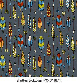 Seamless pattern with arrows and feathers. Vector illustration