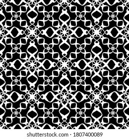 Seamless pattern in art Nouveau style.Complex geometric pattern.Mesh pattern.White pattern on a black background.For decorating fabric, paper, Wallpaper, and packaging.
