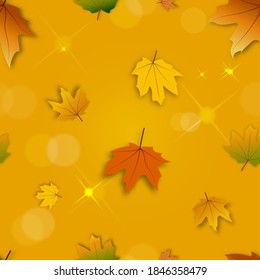 Seamless pattern Autumn background with bokeh effect,Maple leaves in orange and red leaves on blurry bokeh background, Fall season concept with maple foliage on defocused sunlight effect 