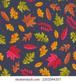 Seamless pattern with autumn bright leaves on a dark blue background. Vector graphics.