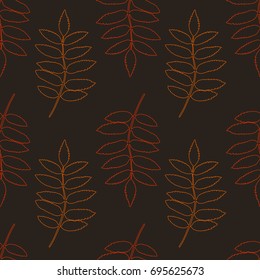 Seamless pattern of autumn contour rowan leaf silhouettes on brown background. Vector texture for your design