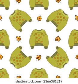 Seamless pattern with autumn cozy green knitted sweater with maple leaves. Seasonal warm clothes. Colorful vector illustration hand drawn. Fall season wrapping, print for fabric or paper