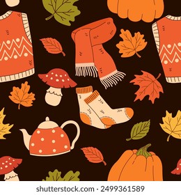 Seamless pattern with autumn elements on a dark background. Scarf, sweater, socks, teapot, pumpkin, vest, leaves. Flat vector illustration.