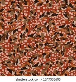 Seamless pattern. Autumn foliage against a scattering of squares.