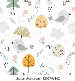 Seamless pattern autumn forest with birds, Christmas trees, trees, flowers, rainbow, rain and clouds. Vector illustration for printing on t-shirts, Wallpaper, packaging, bed linen, textiles, banner