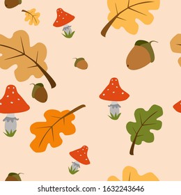 Seamless pattern of autumn forest elements.Fallen leaves, mushrooms, and acorns.