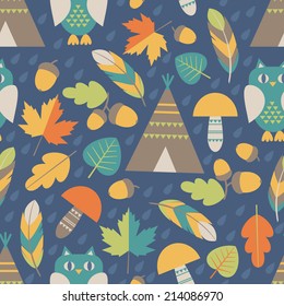 Seamless pattern: autumn forest and native american symbols (owls, feathers, mushrooms, fallen leaves, acorns, teepee tents). Vector illustration. 