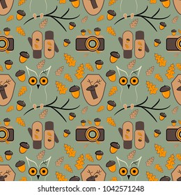 Seamless pattern. Autumn illustration: 
emblem of a deer, owls, camera, gloves, oak leaves, acorns.  Vector design of tile, carpet, tablecloth fabric, cushion, pillow, bags, cover.