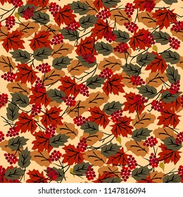 Seamless pattern with autumn leaves and a mountain ash, orange, beige, brown and yellow. Perfectly is suitable for wall-paper, brown paper, a web page background, autumn greeting cards.