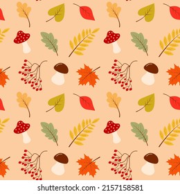 Seamless pattern of autumn leaves, mushrooms and rowan. Scrapbook, gift wrapping paper, textiles.