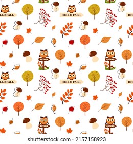 Seamless pattern of autumn leaves, mushrooms, owl, rowan and tree.  Scrapbook, gift wrapping paper, textiles.