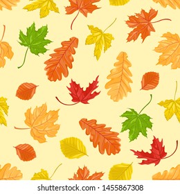 Seamless pattern with autumn leaves of oak, maple and beech on a yellow background. Vector illustration of falling leaf in cartoon flat style.