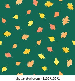 Seamless pattern with autumn leaves on green background. Vector ornament for design