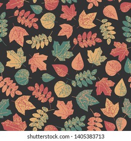 seamless pattern with autumn leaves on a black background