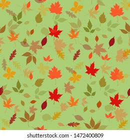 Seamless pattern autumn leaves on a light green background, vector