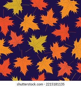 Seamless pattern of autumn leaves on a purple background.