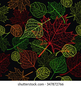 Seamless pattern with autumn leaves on a black background for your design