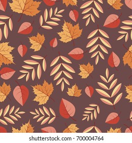 Seamless pattern with autumn leaves on a colored background
