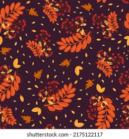 Seamless pattern with autumn leaves  and rowan berries on dark purple background. For textile, giftpaper, wallpaper.