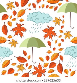 Seamless pattern with autumn leaves, umbrellas and clouds on white background