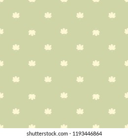 Seamless pattern with autumn maple leaves. Light yellow leaves on pastel green background. Vector illustration