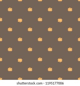 Seamless pattern with autumn maple leaves. Golden yellow leaves on light brown background. Vector illustration