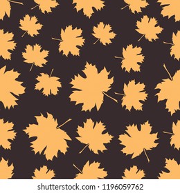 Seamless pattern with autumn maple leaves. Golden yellow leaves on dark background. Vector illustration