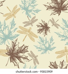 Seamless pattern of autumn, maple leaves and a dragonfly, hand-drawing. Vector.