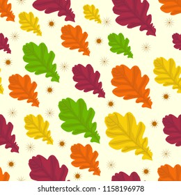 Seamless pattern with autumn oak leaves. Multi-colored vector ornament on yellow for textiles, paper, plastic and web pages