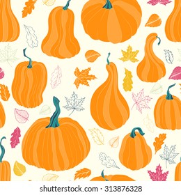 Seamless pattern with autumn pumpkins and leaves. Hand drawn holiday design for Thanksgiving celebration, fabric, wrapping paper, greeting cards, invitation, stationery. 