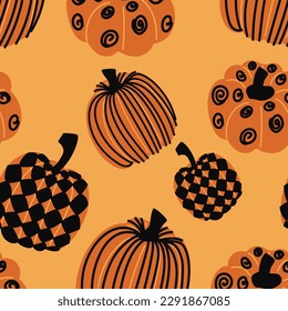 Seamless pattern of autumn pumpkins. Multicolored autumn harvest in yellow and orange colors. Autumn background. Vector illustration.