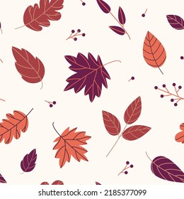 Seamless pattern of autumn purple leaves of various shapes
