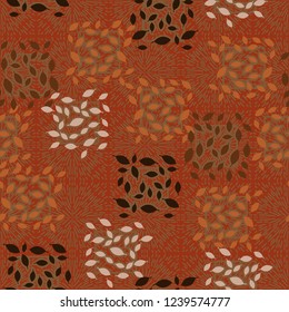 Seamless pattern. Autumn theme. Foliage and squares on the background of fireworks.