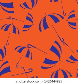 Seamless pattern in autumn theme. Orange-Blue umbrellas on bright background