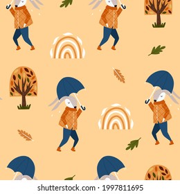 Seamless pattern with autumn trees and funny rabbit. Modern fall seasonal decor. Endless background for fabric, textile, kids design. Hand drawn vector illustration.