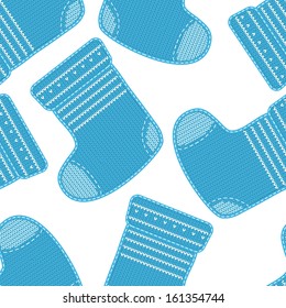 Seamless pattern with baby knitted socks on white background. Arrival background.