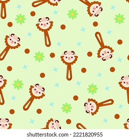 Seamless pattern with baby lamb rattle. Children's pattern on textiles. Gentle children's  green   background